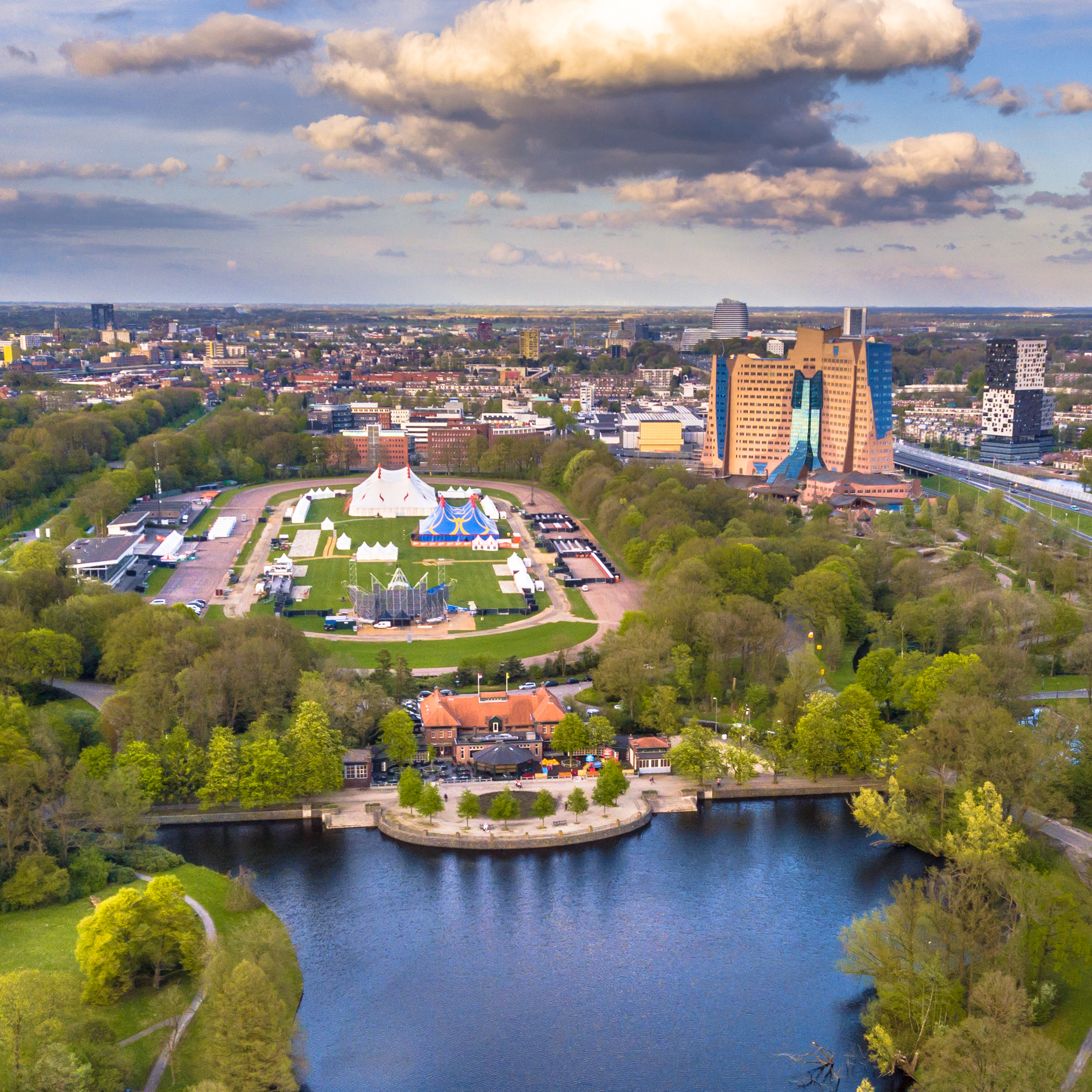 Aerial View of Groningen city Skyline from main park Stadspark area with festival builing up on racetrack event grounds, Netherlands